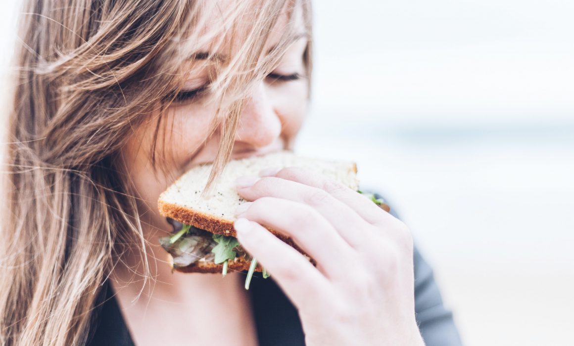 Girl eating sandwich