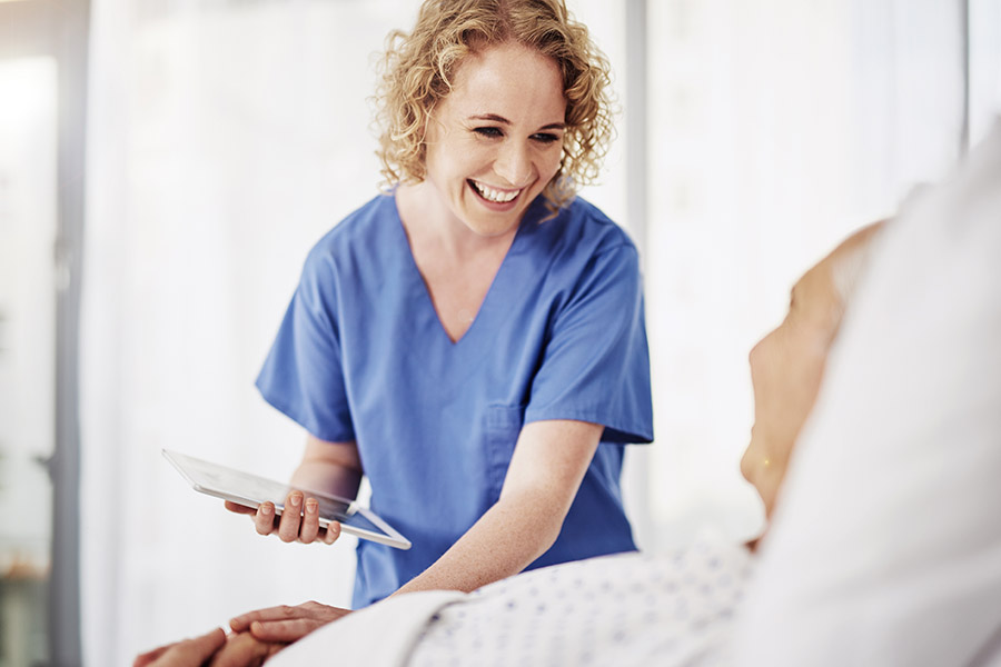 doctor with patient holding an ipad