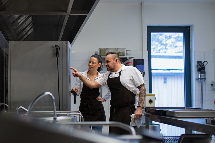 chefs using commercial oven